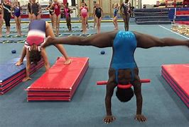 Image result for Gymnastics Press Handstand