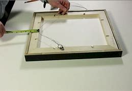 Image result for Attaching Hanging Wire to Picture Frame
