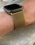 Image result for Black Apple Watch with Gold Milanese Band