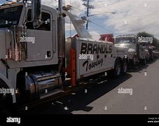 Image result for Tractor On a Tow Truck Jpg