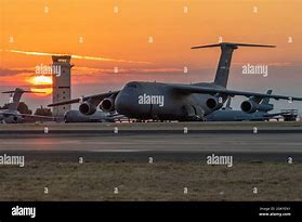 Image result for C-5 Galaxy Loading Huey Cobra