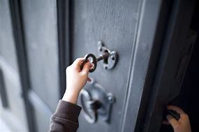 Image result for Picture of a Person Unlocking a Door