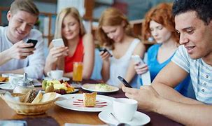 Image result for Person Sitting On Phone at Table