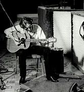 Image result for John Lennon Playing Acoustic Guitar