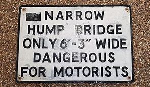 Image result for Slow Down Humpback Bridge Sign