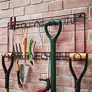 Image result for Yard Tool Hangers for Wall