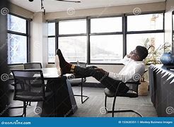 Image result for A Black Man Sitting as a Desk Talking On a Telephone Photos