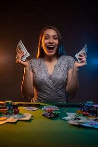 Image result for Woman at Poker Table Collecting Chips as Winner