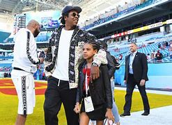 Image result for Jay-Z and Family Sit during National Anthem