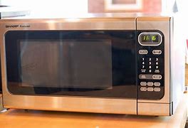 Image result for TBL Shooting Sharp Carousel Microwave Oven