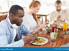 Image result for People Talking On Cell Phone at Table