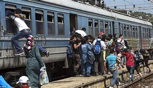 Image result for Photos of Migrants On Trains