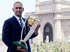 Image result for MS Dhoni with Trophies