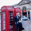 Image result for Person in Red Phone Booth