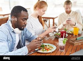 Image result for Person Sitting On Phone at Table