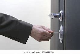 Image result for Man Unlocking Door