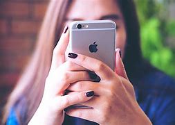 Image result for Images of People Consumed with iPhone Use