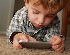 Image result for Children Face in the Glow of Cell Phone