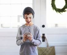 Image result for Boy Looking at Phone