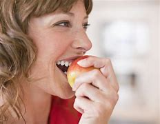 Image result for A Person Eating an Apple