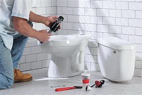 Image result for Plumber Fixing Toilet