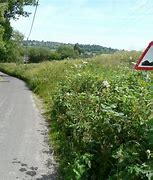 Image result for Uneven Pavement Road Sign
