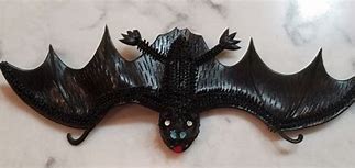 Image result for 11 X 5 Vintage Black Rubber Bat