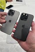 Image result for iPhone 13 Pro On a Black Hand