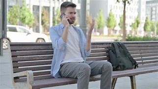 Image result for Angry Man Sitting Using Phone
