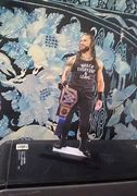 Image result for WWE Statue Sony Roman Reigns