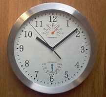 Image result for Clamshellanalogslim Pocket Travel Quartz Alarm Clock Silver