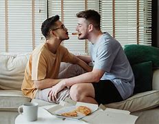 Image result for Photo of 2 People Sitting On Sofa