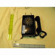 Image result for Black Rotary Phone in Spotlight