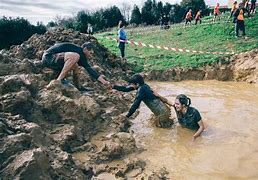 Image result for Obstacle Course Race Pulling Log through the Mud