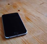 Image result for Image of Apple iPhone On Table