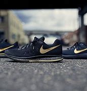 Image result for Nike Black Gold Trainers
