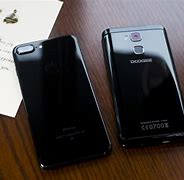 Image result for iPhone 7 vs 6 Plus Size On Hand