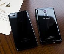 Image result for iPhone 7 vs 6 Plus Size On Hand