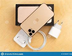 Image result for iPhone 11 Pro On a Dime Wooden Table