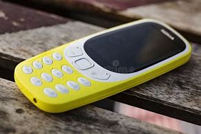 Image result for Nokia 3310 On Table