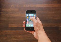 Image result for iPhone 4 in Children Hand