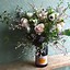 Image result for Flowers in an Andre Champagne Bottle