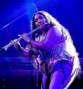 Image result for Lizzo Twerking Playing the Flute