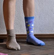 Image result for A Woman Wearing Mismatched Socks