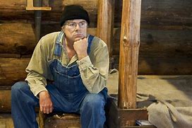 Image result for Man by Log Cabin