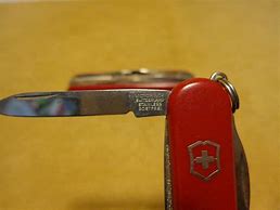 Image result for Rostfrei Stainless Serrated Blade Red Keychain Lockback June Bug Pocket Knife