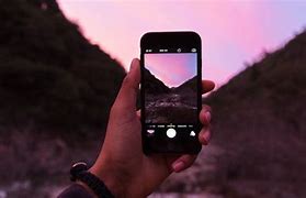 Image result for Holding iPhone Outside