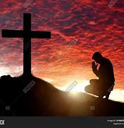 Image result for Man Praying in the Sunset Cross