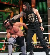 Image result for WWE Seth Rollins and Roman Reigns