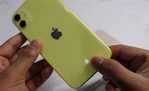 Image result for Holding iPhone 11 Yellow